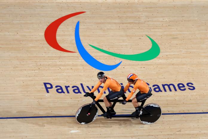 Dutch Para cyclist Tristan Bangma and pilot Patrick Bos compete on a tandem bike at the Tokyo 2020 Paralympics.
