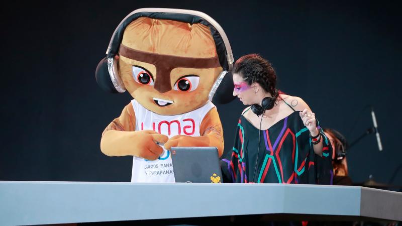 a giant mascot and a DJ dance on the stage