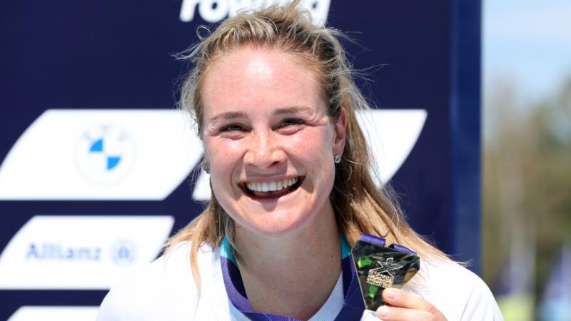 Para rower Birgit Skarstein smiling and holding a gold medal 