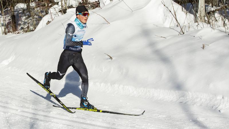 A man with one arm doing cross-country skiing