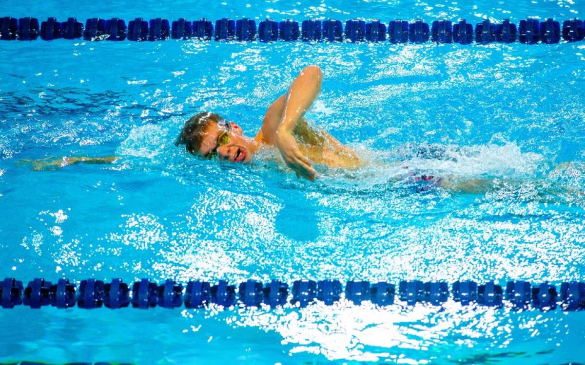 A male swimmer in a competition