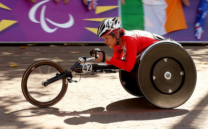 Japanese woman competing in her racing chair