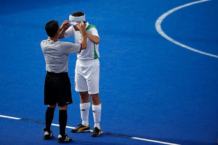 Referee checks blind footballer's eyeshades