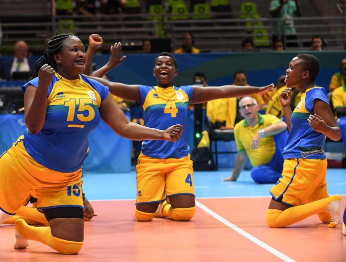 Rwanda women's sitting volleyball players celebrate a point