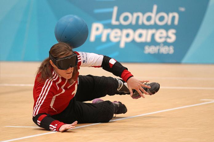 Woman tries to stop a goalball