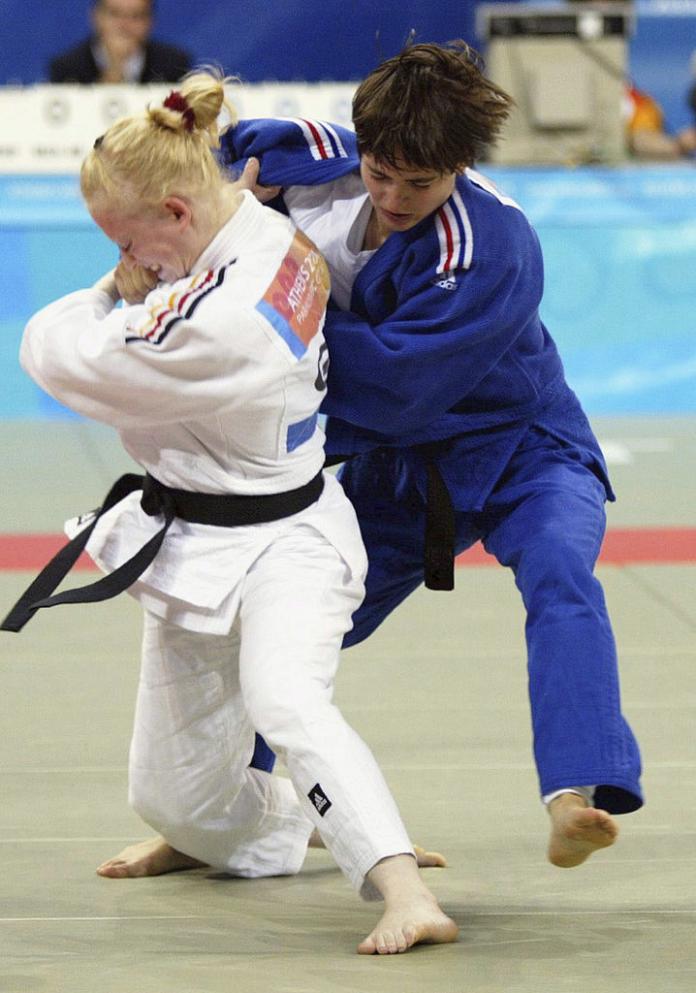 Female judoka in position to pull down her opponent