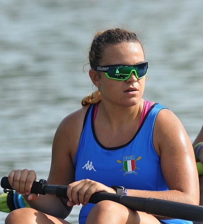 Female rower with sunglasses on boat