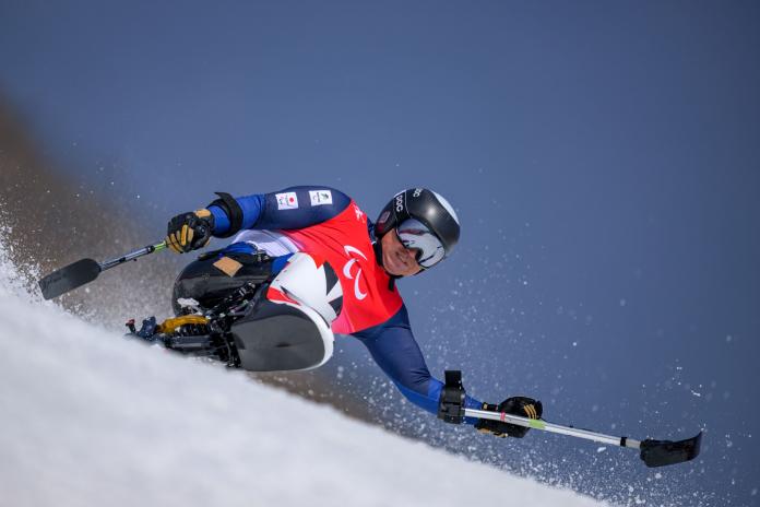 A male sit skier competes at Beijing 2022.