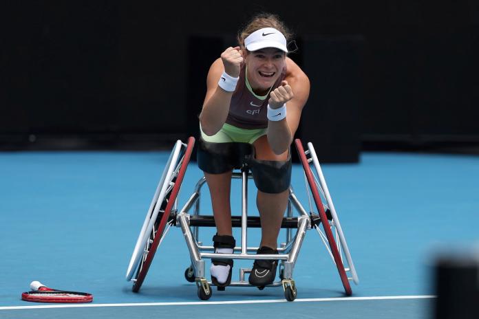Diede de Groot, a Dutch wheelchair tennis player, pumps up her fist on court