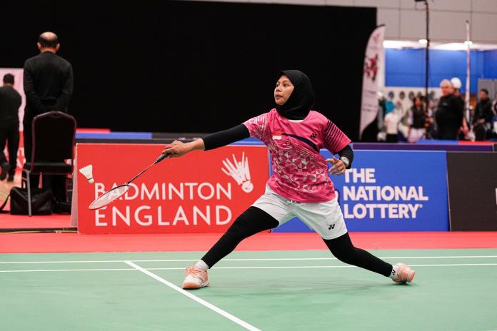 A female Para badminton player in action