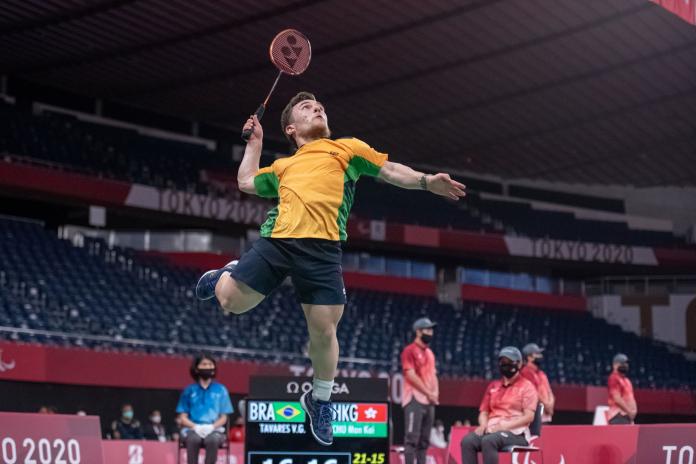 A male Para badminton jumps during a match at the Tokyo 2020 Paralympics.
