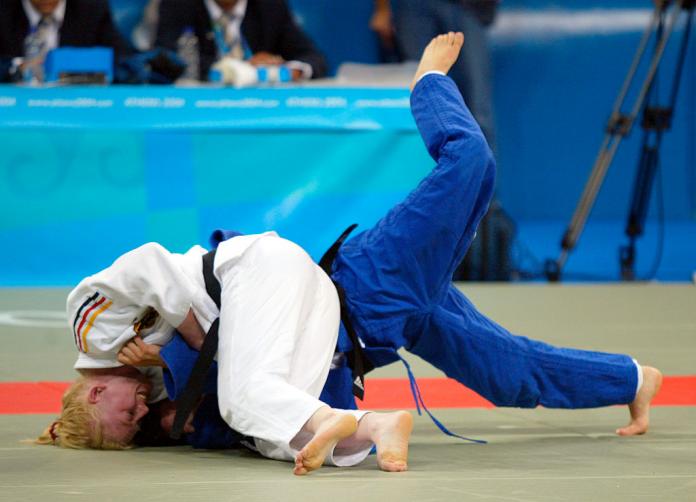 Two female judo athletes in action at Athens 2008.