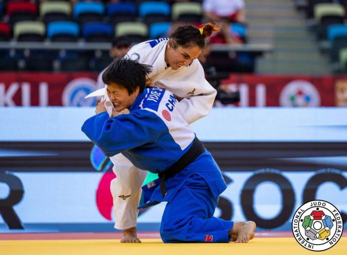 Two female judokas in action.