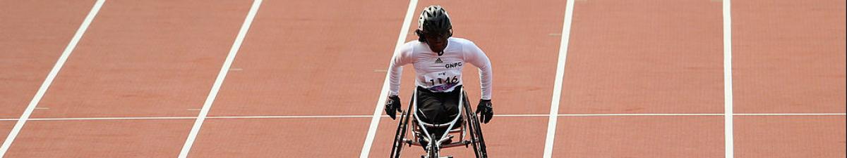 a female wheelchair racer on the tract