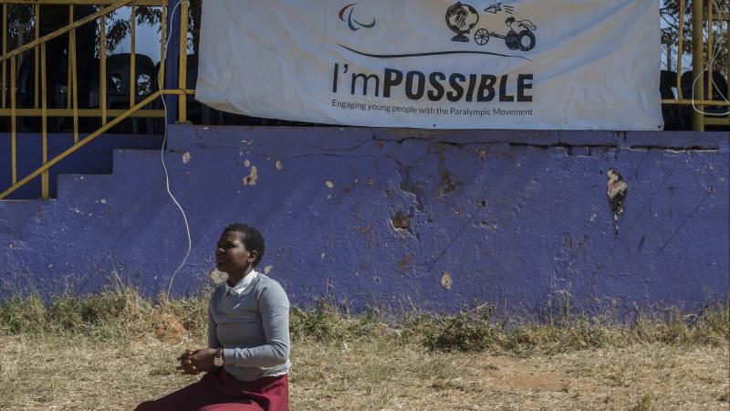 Girl play sitting volleyball during I'mPOSSIBLE event in Malawi