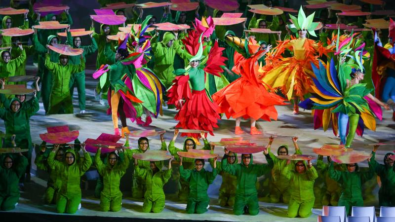 dancers in rainbow colours on a stage