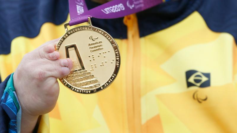 a close up of a Lima 2019 Parapans gold medal
