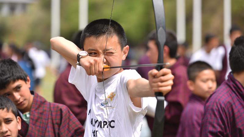 Boy tries Archery during Paralympic Day in Bhutan