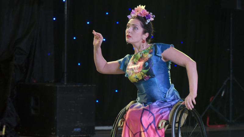 Woman in wheelchair performing in Para dance