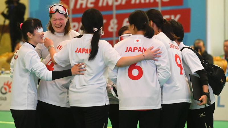 Japanese female goalball players embracing
