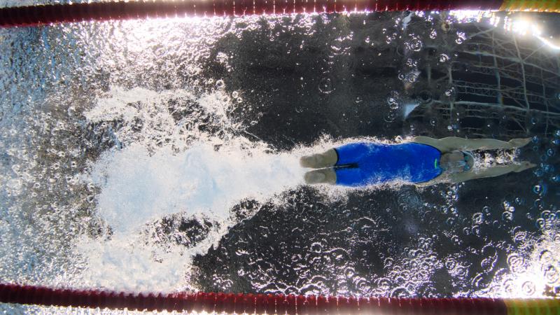 An underwater image of a female swimmer without legs