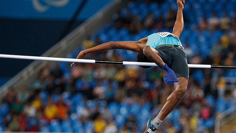 A man competing in the high jump 