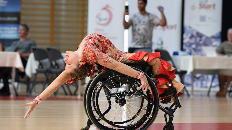 Image of a female dancer in her wheelchair