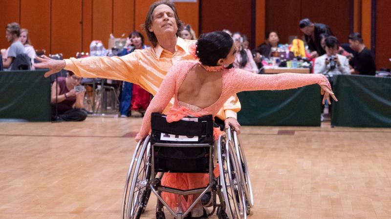 A pair of wheelchair dancers in a competition