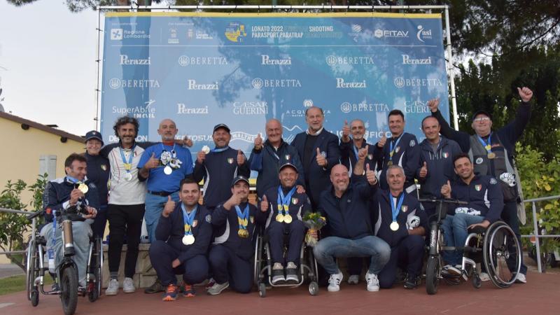 Medallists at the Lonato 2022 give a thumbs up to the organisers on a successful first ever Para Trap European Championships. 