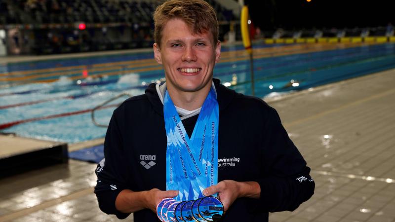 Australia's Timothy Hodge poses with his medals at the season-opening Citi Para Swimming World Series Australia 2023 .