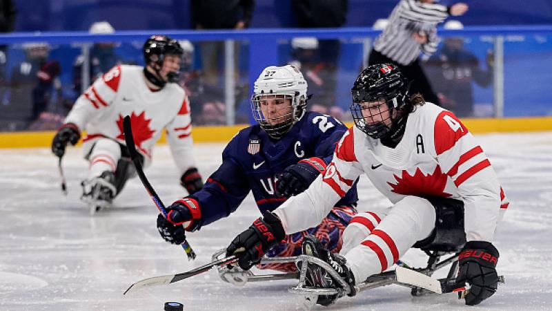 USA and Canada Para ice hockey players on ice 