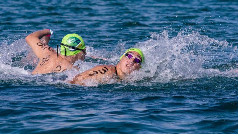 Two male swimmers in an open water competiion
