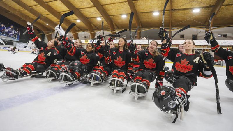 The Canadian women's Para ice hockey team waving to the crowd