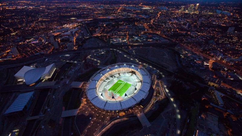 Aerial view of the London 2012 Olympic stadium with a "one" made of green lights in the center
