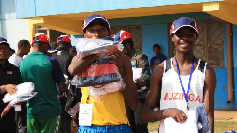 athletes holding packs from Atos