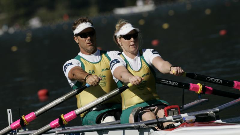 A picture of 2 people rowing together