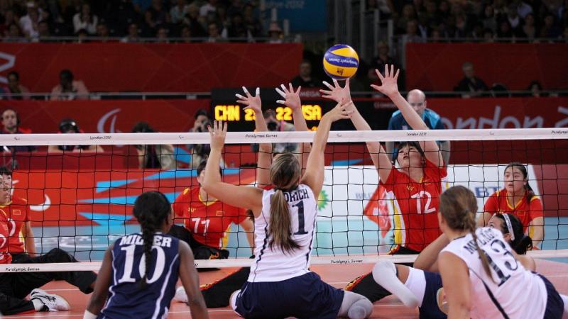 A picture of women playing Sitting Volleyball