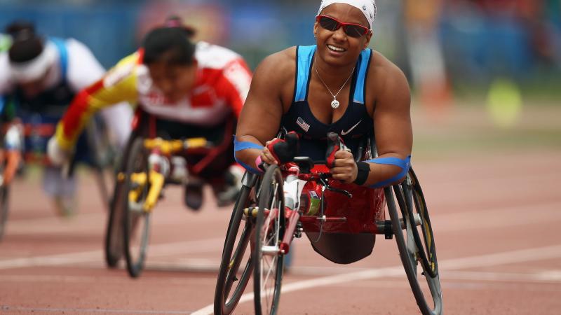 A picture of a woman in wheelchair celebrating her victory 