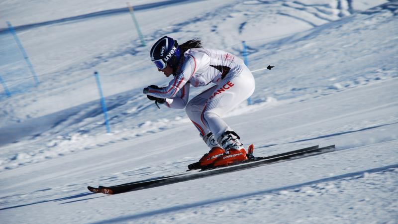 A picture of a woman skiing.