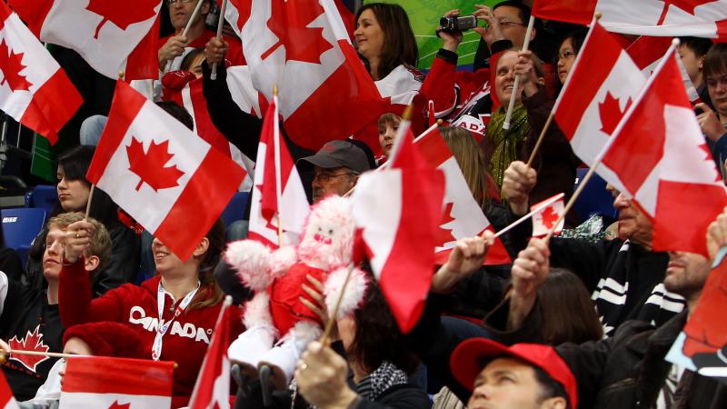A picture of supporters waving canadian flags