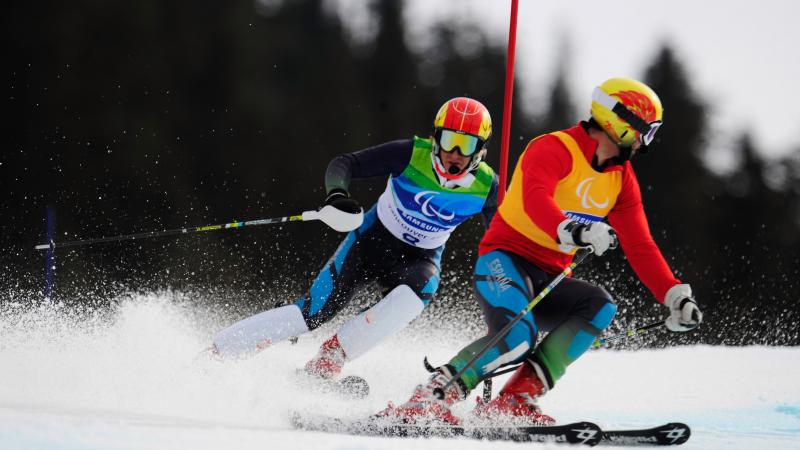 Jon Santacana Maiztegui of Spain and his guide Miguel Galindo Garces compete in Vancouver