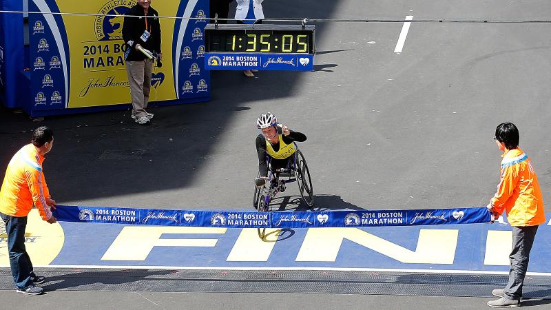 Tatyana McFadden, a wheelchair racer, crosses the Boston Marathon finish line