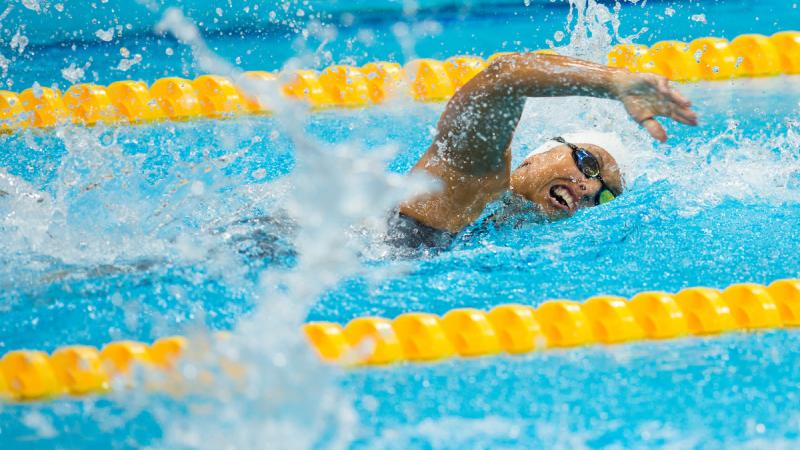 Women swimming a freestyle race