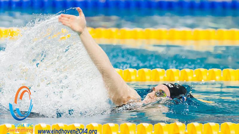A female swimmer in a race at the 2014 IPC Swimming European Championships.