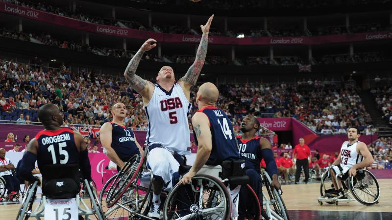 Joseph Chambers of United States reaches for the ball during the bronze medal Wheelchair Basketball match between United States and Great Britain at the London 2012 Paralympic Games