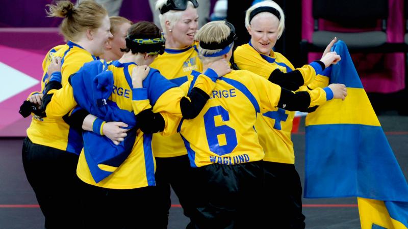 The team of Sweden celebrates after winning their Women's Team Goalball Bronze Medal match against Finland at the London 2012 Paralympic Games.