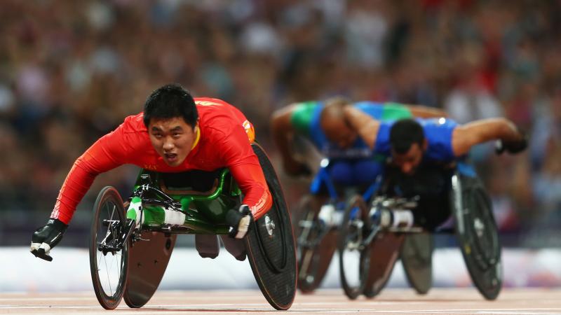 Huzhao Li of China crosses the line to win gold in the Men's 200m T53 Final at the London 2012 Paralympic Games.