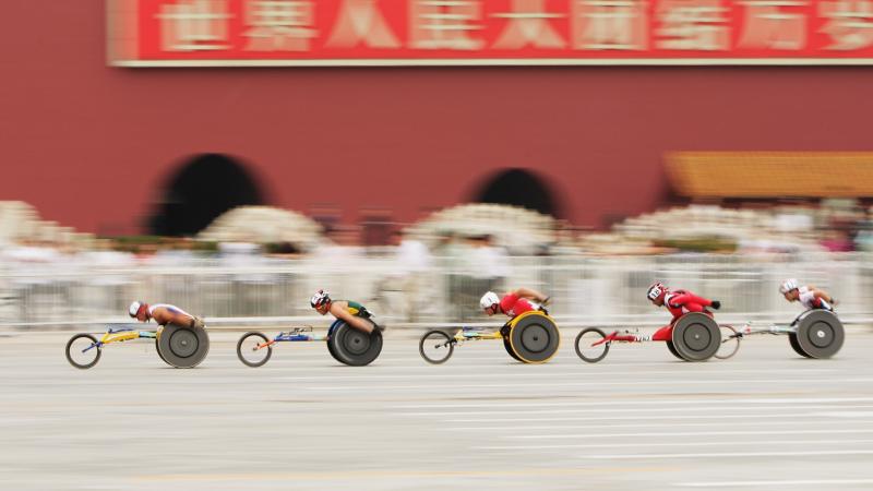 The lead group of the marathon goes past the Forbidden City at Tiananmen Square at the Beijing 2008 Paralympic Games. 