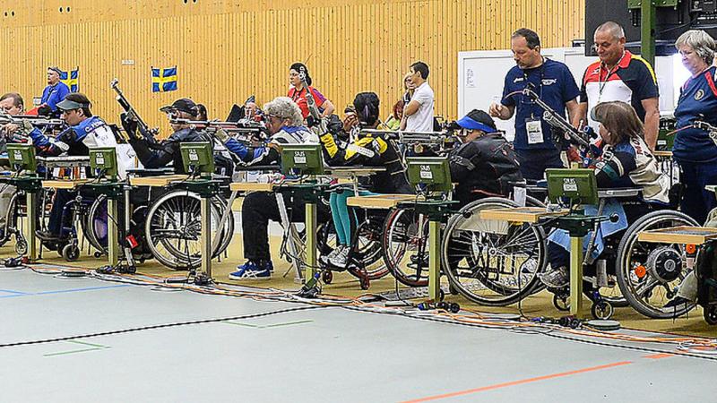 Shooters take aim during rifle competitions at the 2014 IPC Shooting World Championships