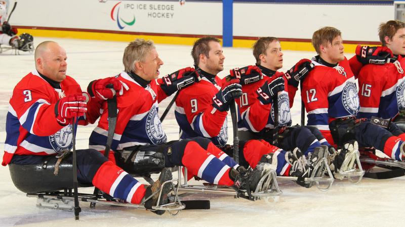 Norway's team listens to their national anthem after defeating Japan in their final prelminary round game at Buffalo 2015.